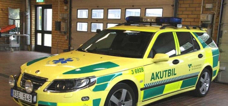 Saab 9-5: From Law Enforcement to Lifesaver – A captivating transformation captured as the Saab 9-5 dons its vibrant 'Ambulance Yellow' livery, transitioning from a specialized police cruiser to a life-saving medical vehicle.