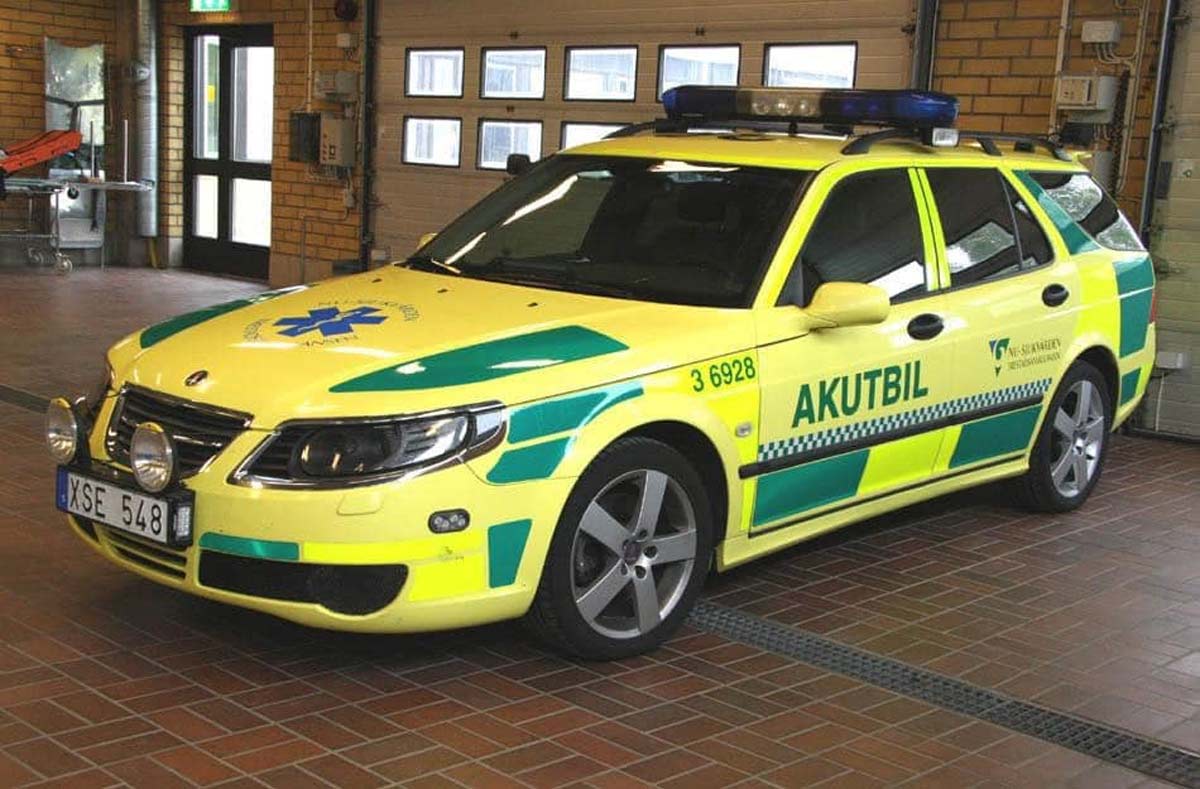 Saab 9-5: From Law Enforcement to Lifesaver – A captivating transformation captured as the Saab 9-5 dons its vibrant 'Ambulance Yellow' livery, transitioning from a specialized police cruiser to a life-saving medical vehicle.