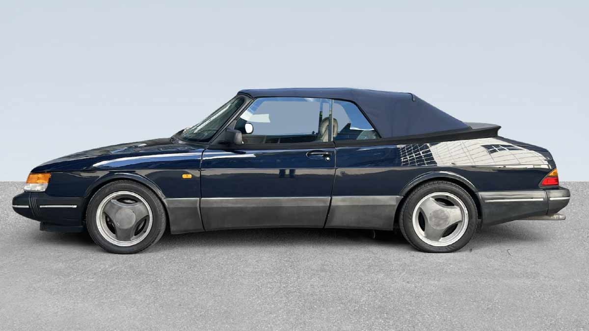 The 1992 Saab 900 Turbo S Aero Convertible in pristine condition, showcasing its iconic design and timeless elegance with the top up. A true classic offered by Auto Tjuvholmen.