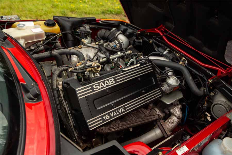 the 1990 Saab 900 Turbo 16 Convertible's engine, showcasing the 16-valve powerhouse that gives this classic its spirited performance.