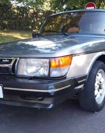 Under the spotlight: A gleaming 1984 Saab 900 Turbo, meticulously restored to its original splendor, symbolizes the timeless allure of Swedish engineering and passion for automotive heritage.