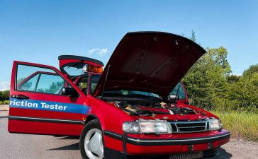 The rare 1996 Saab 9000 SFT, recently rescued and restored by Igor Stankov and his family, showcased in all its glory. This unique friction tester vehicle, originally used at an airport, has only 25,000 kilometers on the odometer and features a distinctive red color, setting it apart from the typical yellow SFT cars.