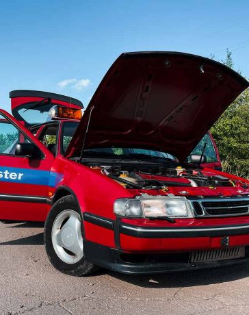 The rare 1996 Saab 9000 SFT, recently rescued and restored by Igor Stankov and his family, showcased in all its glory. This unique friction tester vehicle, originally used at an airport, has only 25,000 kilometers on the odometer and features a distinctive red color, setting it apart from the typical yellow SFT cars.