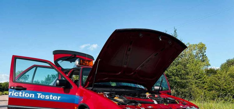 The rare 1996 Saab 9000 SFT, recently rescued and restored by Igor Stankov and his family, showcased in all its glory. This unique friction tester vehicle, originally used at an airport, has only 25,000 kilometers on the odometer and features a distinctive red color, setting it apart from the typical yellow SFT cars.