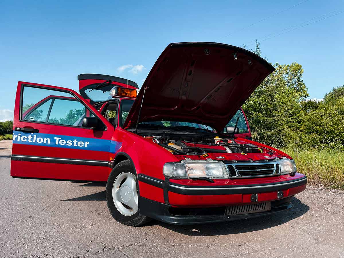 The rare 1996 Saab 9000 SFT, recently rescued and restored by Igor Stankov and his family, showcased in all its glory. This unique friction tester vehicle, originally used at an airport, has only 25,000 kilometers on the odometer and features a distinctive red color, setting it apart from the typical yellow SFT cars.