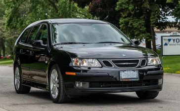 Pristine 2007 Saab 9-3 SportCombi in glossy black, showcasing its sleek design and elegant stance