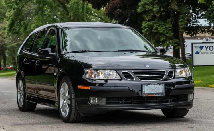 Pristine 2007 Saab 9-3 SportCombi in glossy black, showcasing its sleek design and elegant stance