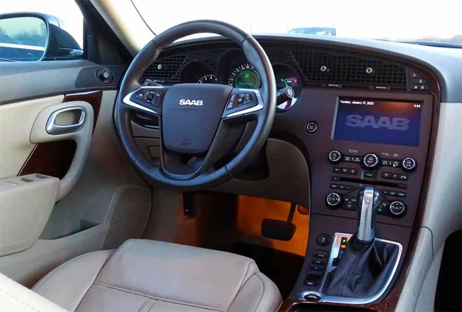 Inside the Classic: The Luxurious Beige Leather and Subtle Wood Accents of the 2011 Saab 9-5 Aero's Cabin