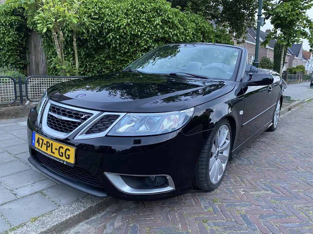 Frontal elegance in motion: The Saab 9-3 Aero Convertible with its roof down, displaying its modern facelift and Hirsch Performance enhancements.