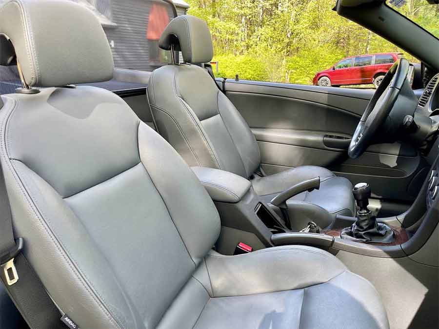 Indulge in Luxury: Immaculate Grey Interior of the Laser Red 2007 Saab 9-3 Turbo Convertible