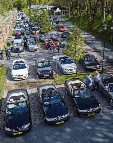 Enthusiasts and their cherished Saab convertibles line up for a picturesque gathering during the 2024 Saab Convertible Weekend at Nationalpark Harz, showcasing a vibrant display of community and automotive passion (photo by David Joost Kamermans)