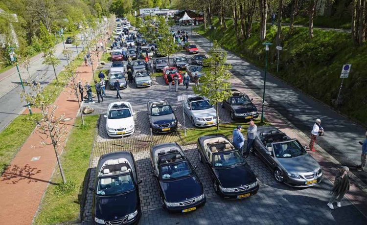 Enthusiasts and their cherished Saab convertibles line up for a picturesque gathering during the 2024 Saab Convertible Weekend at Nationalpark Harz, showcasing a vibrant display of community and automotive passion (photo by David Joost Kamermans)