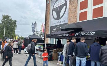 Enthusiasts gather at the Saab Turbo Club of Sweden booth during the 2024 Saab Festival in Trollhättan, celebrating 75 years of Saab Spirit. (photo by Marko Nikitović)