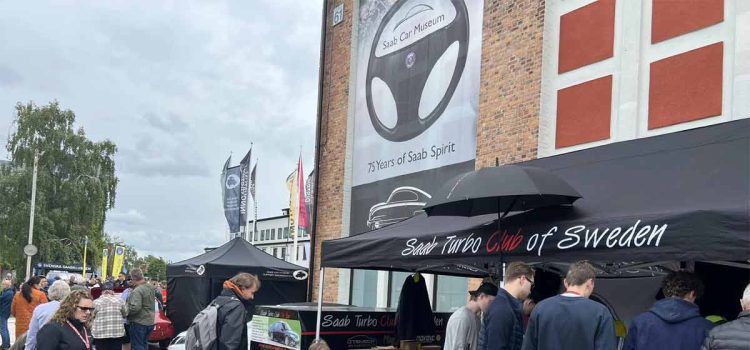 Enthusiasts gather at the Saab Turbo Club of Sweden booth during the 2024 Saab Festival in Trollhättan, celebrating 75 years of Saab Spirit. (photo by Marko Nikitović)