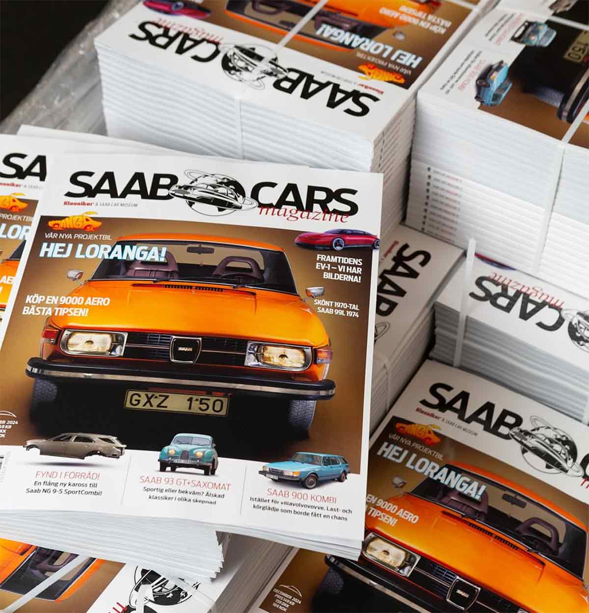 Stacks of Saab Cars Magazine Issue 13, featuring the iconic Saab 900 and packed with exclusive content, now available at the Saab Car Museum and online.