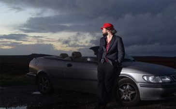 Louis Raban-Ledger with his Saab Convertible – the inspiration behind his visually striking tribute book to Saab’s legacy.