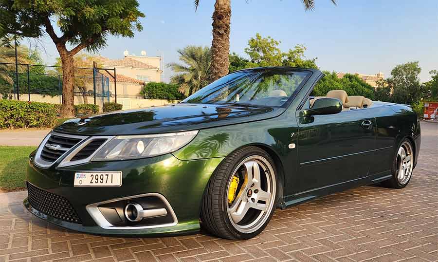 A beautifully customized green Saab 9-3 Convertible, meticulously upgraded by Dušan in Dubai. This unique vehicle features a special Roland Garros green paint, inspired by the Peugeot 205 GTI Roland Garros edition, adding a touch of elegance and exclusivity.