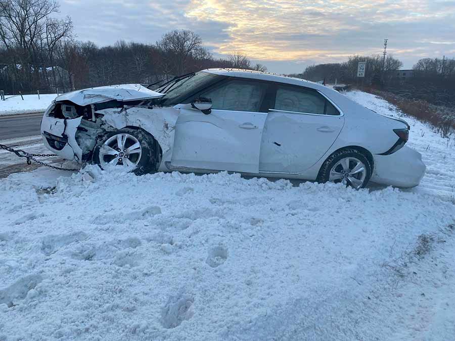 9-5 NG after sliding off the icy highway, bearing the marks of impact but preserving the lives of its occupants with remarkable safety features