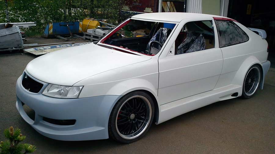 An early stage of the Saab 900 2.0T WideSide Edition's transformation, showing the custom bodywork and wide fenders before the final paint job, highlighting the extensive craftsmanship involved in this unique build.