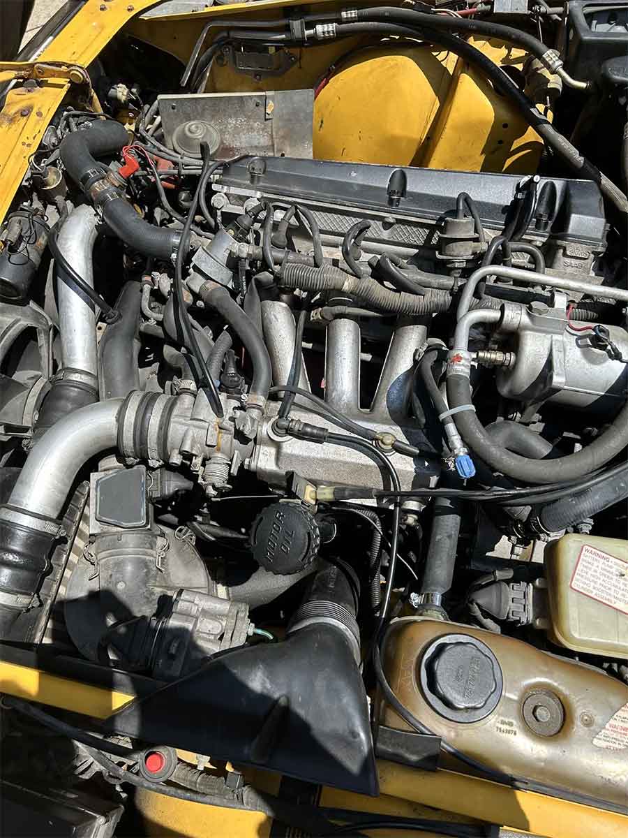 Under the hood of the 1991 Saab 900 SE Turbo Convertible lies a replacement turbocharged 2.0-liter inline-four engine, showcasing the meticulous upgrades and maintenance performed by the owner.