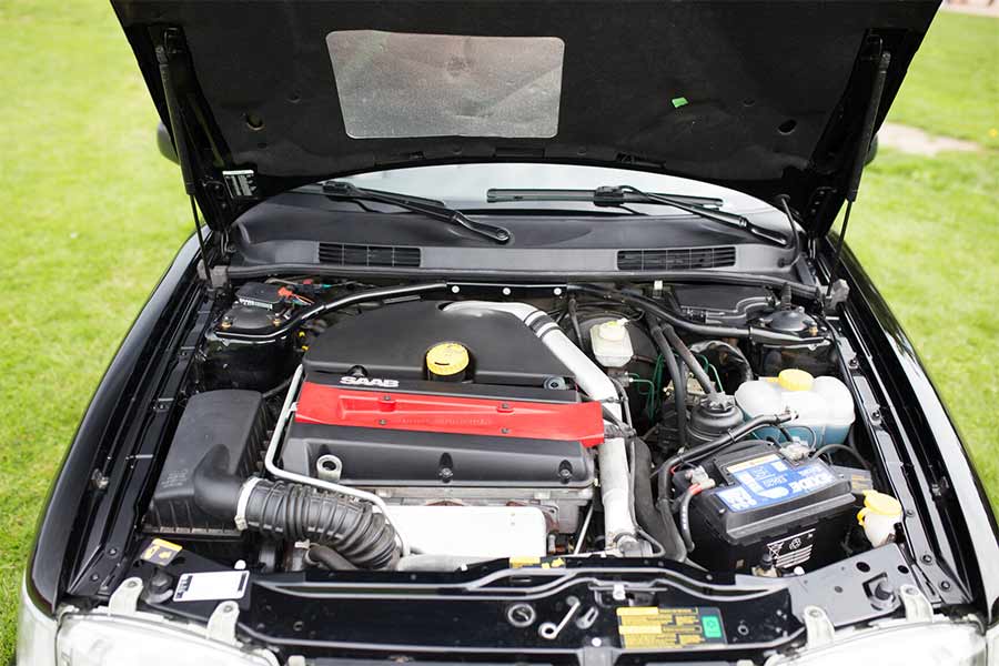 The turbocharged 2.0-liter engine of the 1998 Saab 9-3 SE 2.0T Convertible is in pristine condition, running as smoothly as it did when new, a testament to the meticulous care and maintenance it has received throughout its life.