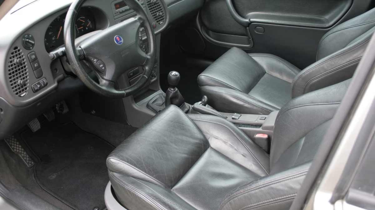 "Luxury Preserved: Immaculate Black Leather Interior of the Saab 9-3 Aero Coupe, a Haven of Comfort and Elegance.