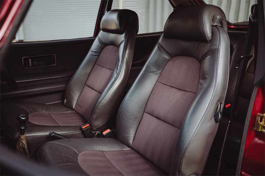 Interior elegance of the 1993 Saab 900 Turbo Ruby Edition, featuring luxurious Bridge of Weir leather with Zegna wool inserts.