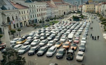 An awe-inspiring aerial shot of Saab Session Slovakia 2024 in Banská Bystrica, featuring a meticulously arranged lineup of Saab models from across Europe.