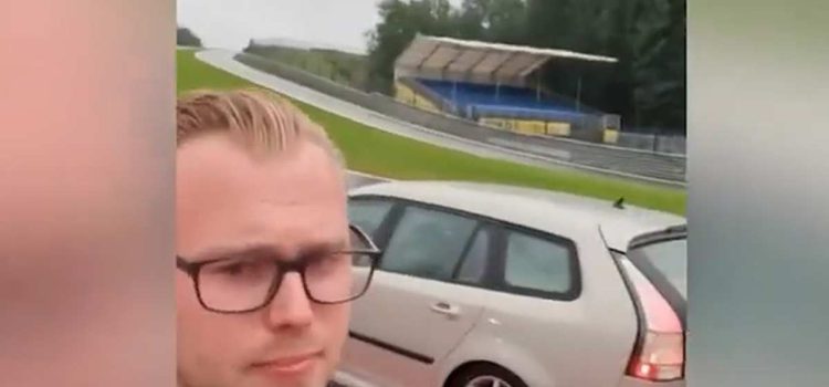 Chasing Dreams: A Dutch Enthusiast Captures the Ultimate Joyride Moment, Posing Proudly with His Saab 9-3 SportCombi on the Iconic Spa-Francorchamps Circuit."