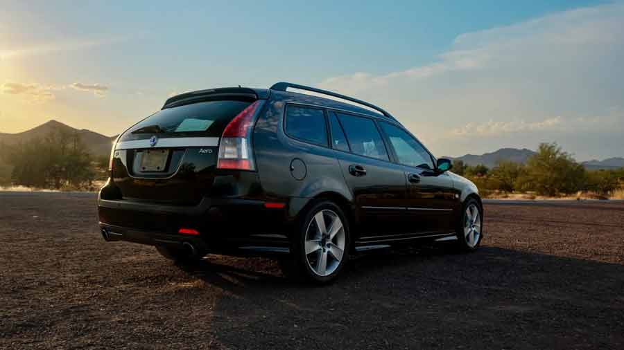 As the sun sets behind the mountains, the 2006 Saab 9-3 Aero SportCombi stands poised, its sleek lines and Aero badge reflecting a perfect balance of family practicality and high-performance pedigree.