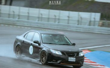 A rare Saab 9-3 Turbo X showcasing its prowess during a track day in Taiwan, braving the wet conditions with its advanced XWD system and performance modifications.