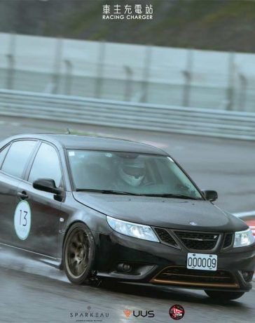 A rare Saab 9-3 Turbo X showcasing its prowess during a track day in Taiwan, braving the wet conditions with its advanced XWD system and performance modifications.