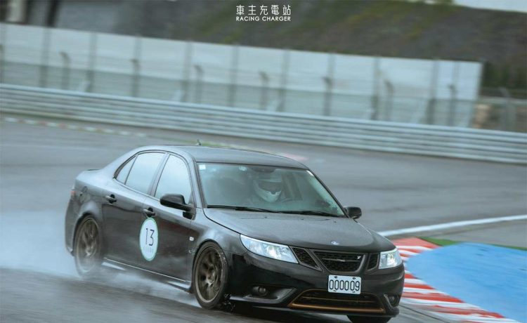 A rare Saab 9-3 Turbo X showcasing its prowess during a track day in Taiwan, braving the wet conditions with its advanced XWD system and performance modifications.