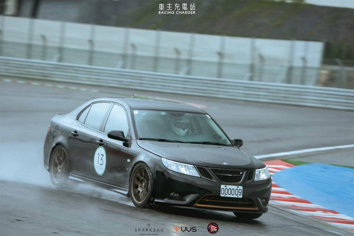 A rare Saab 9-3 Turbo X showcasing its prowess during a track day in Taiwan, braving the wet conditions with its advanced XWD system and performance modifications.