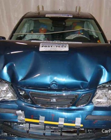 The Saab 9-3 after an unbelted frontal crash test at 40 km/h, showcasing the strength of its passive safety features—protecting occupants even in extreme conditions.