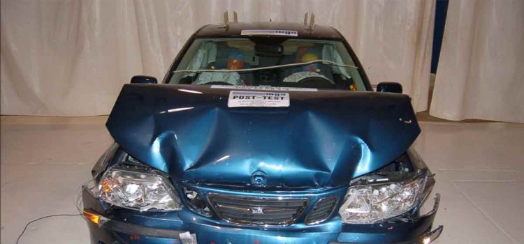 The Saab 9-3 after an unbelted frontal crash test at 40 km/h, showcasing the strength of its passive safety features—protecting occupants even in extreme conditions.