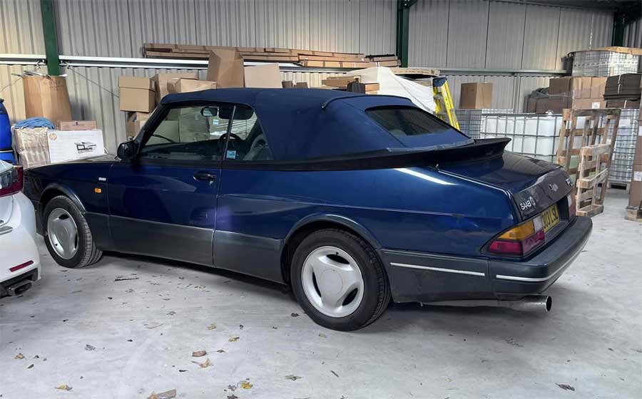 The interior photo displays a well-worn taupe leather seat, showing character and memories of journeys past, indicating that the Saab 900 Convertible has been enjoyed over the years. The exterior shot reveals the car's iconic profile and its distinguished blue color with the matching roof, suggesting a car that's structurally sound and ready for the love and care of restoration. 