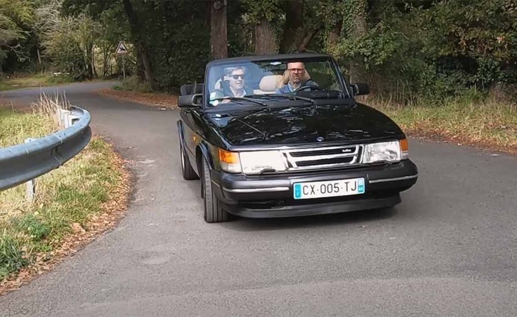 Ronan Rocher and Cedric Freour cruising in Ronan's classic Saab 900 Convertible during their interview for Petites Observations Automobiles (POA), showcasing the timeless elegance and performance of this iconic Swedish car.