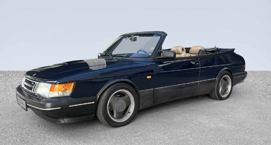 The 1992 Saab 900 Turbo S Aero Convertible with its top down, displaying its sleek lines and luxurious interior. 