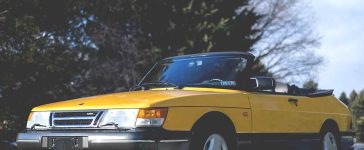 A remarkably preserved 1991 Saab 900 Turbo Convertible in Monte Carlo Yellow, commanding a record auction price of $59,000.