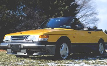 A remarkably preserved 1991 Saab 900 Turbo Convertible in Monte Carlo Yellow, commanding a record auction price of $59,000.