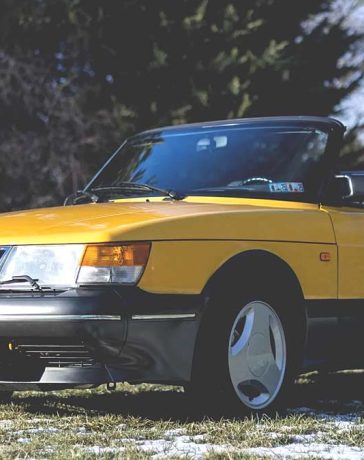 A remarkably preserved 1991 Saab 900 Turbo Convertible in Monte Carlo Yellow, commanding a record auction price of $59,000.