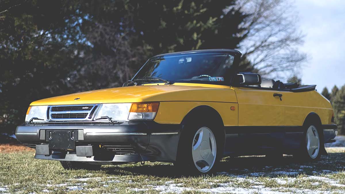 A remarkably preserved 1991 Saab 900 Turbo Convertible in Monte Carlo Yellow, commanding a record auction price of $59,000.