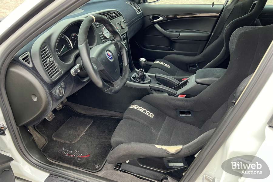 Racing-Ready Cockpit: The Saab 9-3 XWD 'Lillebror' features sporty Sparco seats and a performance-focused interior, blending comfort with competitive edge.