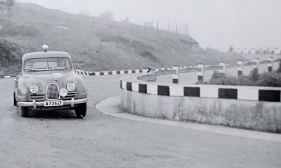 The Saab 93A navigating a winding section of the 1957 Mille Miglia, showcasing its agility and resilience on the challenging Italian roads that led to its class victory.