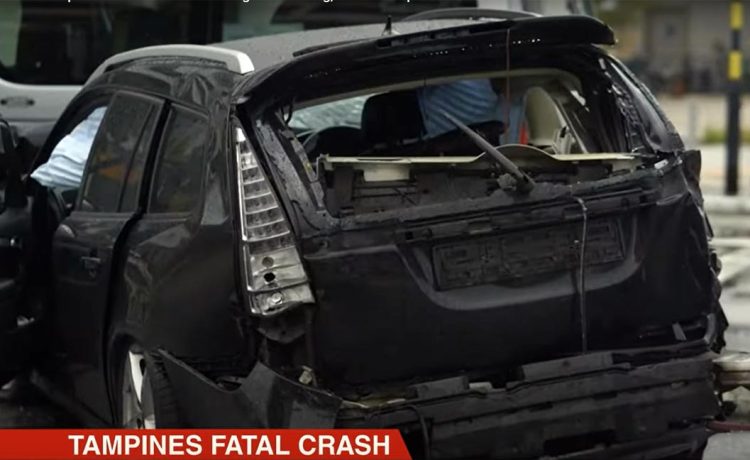 Aftermath of a devastating collision at Tampines junction: A severely damaged Saab 9-3 Aero remains at the scene, a stark reminder of the fatal consequences of traffic violations.