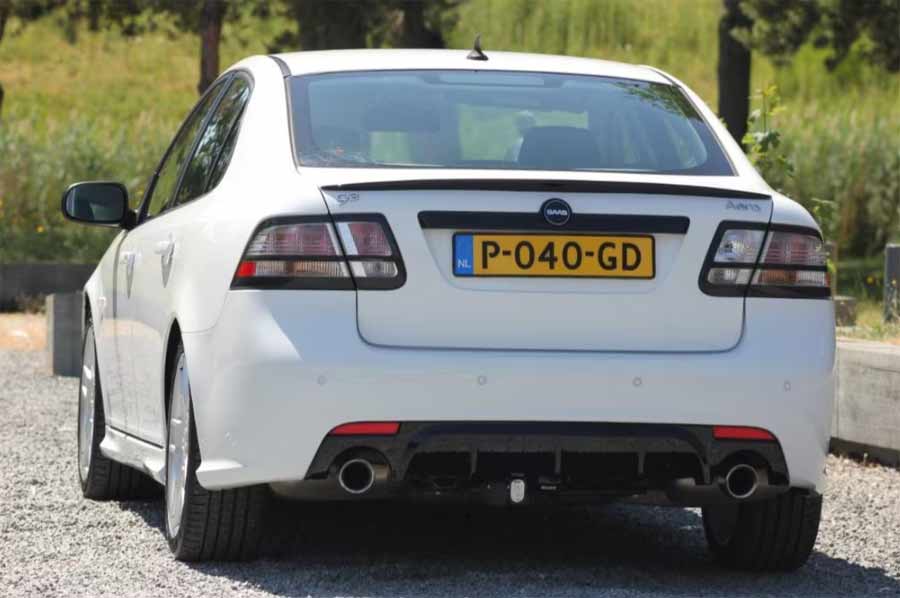 Elegant rear view of the Saab 9-3 Aero, featuring a sleek Hirsch diffuser and sporty spoiler, epitomizing performance luxury.