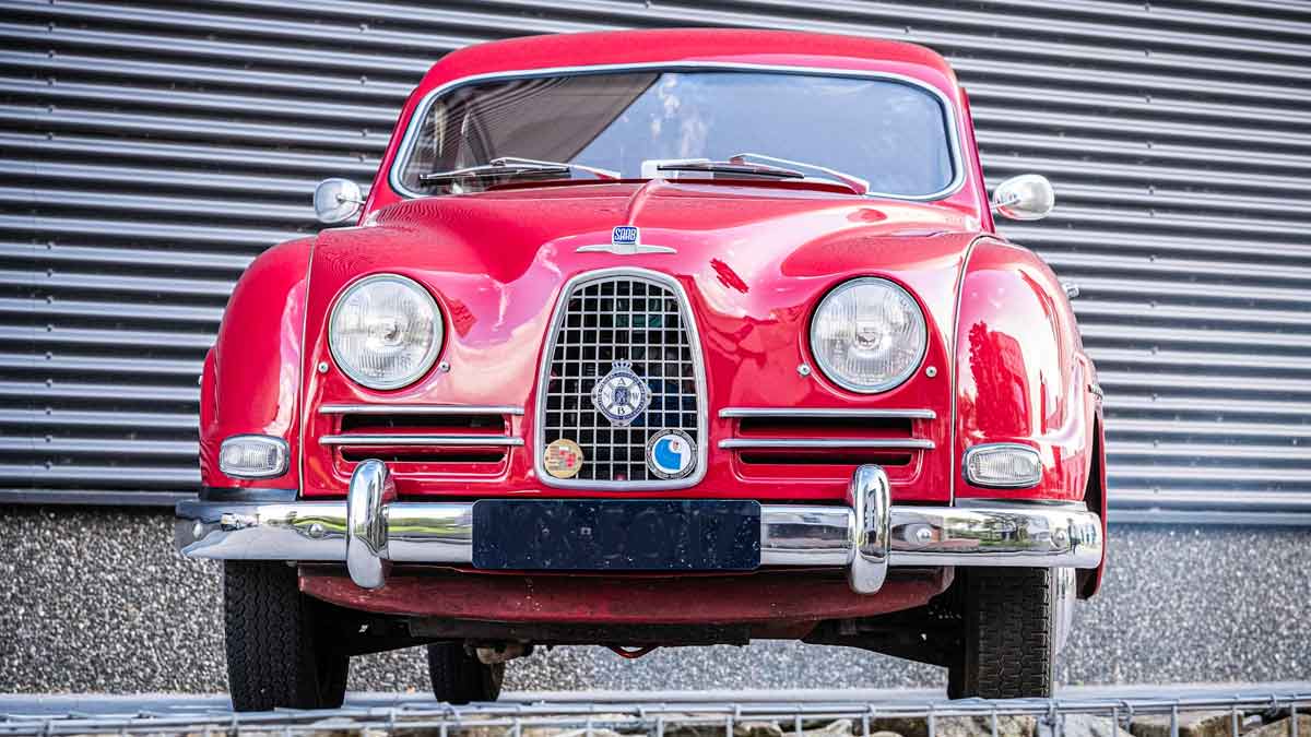 Polished and poised, this red 1957 Saab 93B classic showcases its elegant Swedish design and timeless appeal.