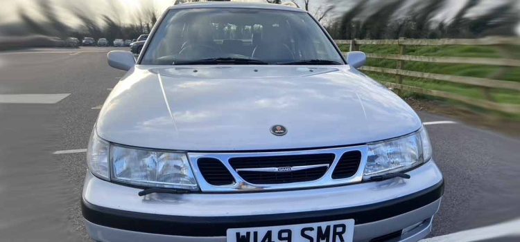 An immaculate Saab 9-5 SportCombi in pristine condition, gleaming under the sun with its ceramic-coated finish, ready to captivate the hearts of automotive enthusiasts and collectors alike.