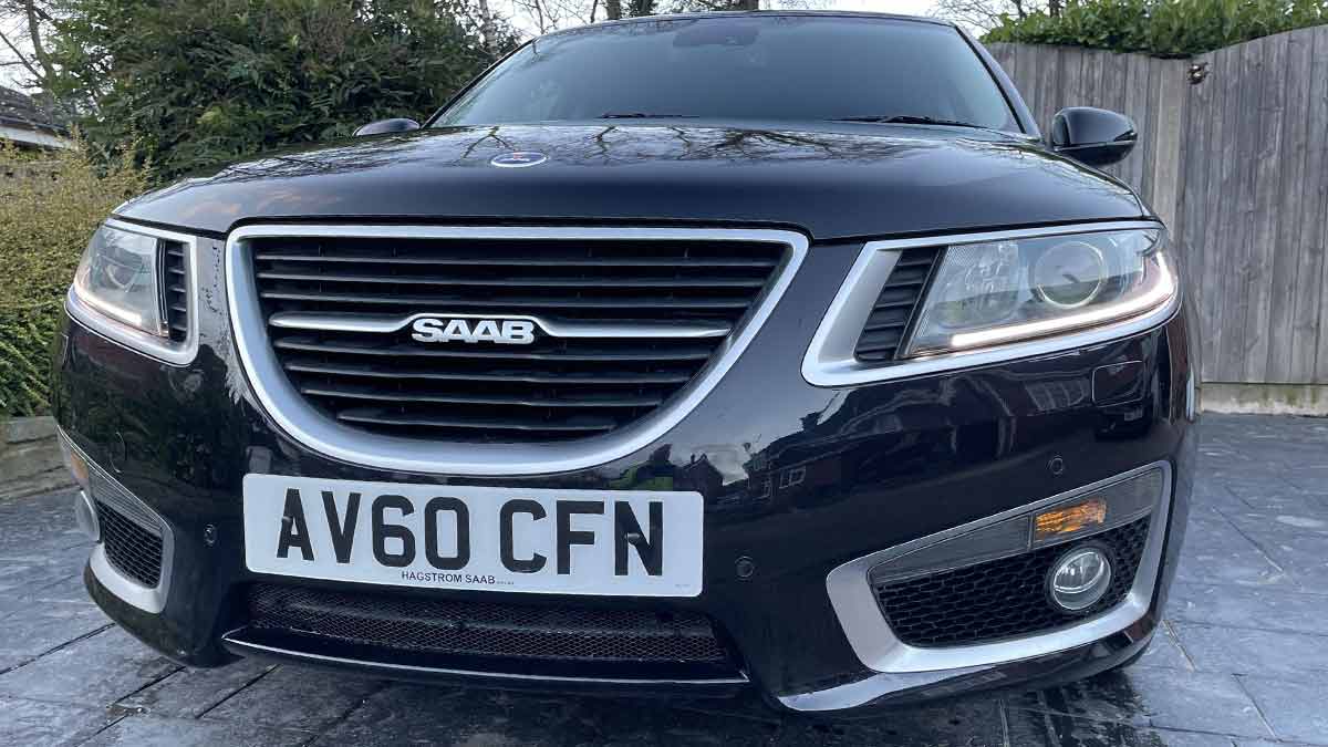 Front View of the 2010 Saab 9-5 Aero: Showcasing its sleek black elegance and the distinctive design that marks Saab's engineering prowess.